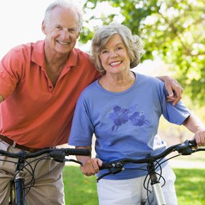 Eldery couple riding bikes